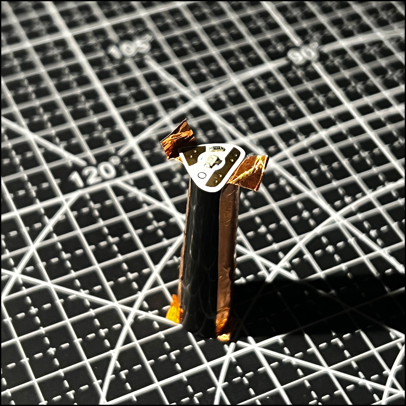 A closer view of the cap of the pen showing the light flush with the copper tape.